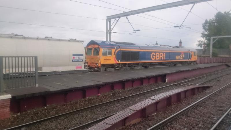 66737 at Coatbridge Central: 66737 passing through Coatbridge Central on the 6E45 Ft.William to North Blyth Alcan empties (13.09.17). Photo of 66737 at Coatbridge Central