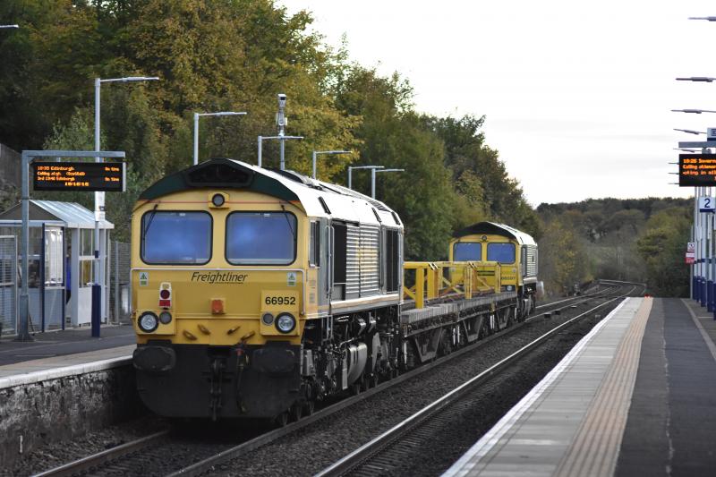 6K50: Saturday, 7th October, 2017, sees 66597 and 66952, returning Freightliner locos from Keith to Millerhill, rattling southbound through Markinch, catching last of the sun at 18.15. Photo of 6K50