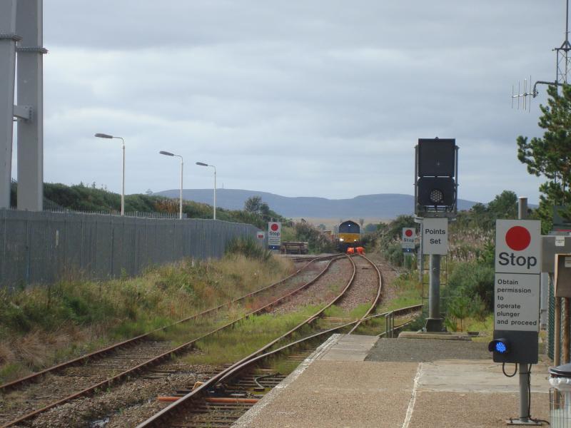 Georgemas: 66305 Driver & NetworkRail employee inspecting points at Georgemas on 17th September prior to 66305 with ballast wagons moving forward into loop from overnight work at Forsinard. Photo of Georgemas