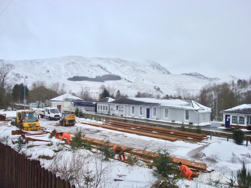 Photo of McCulloch Rail Staff Loading Rail at Crianlarich