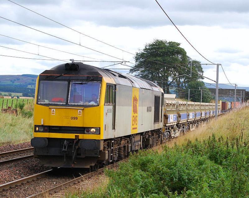 Tug Power: EWS tug 60099 heads the 6S50 Carlisle Yrd - Millerhill NB past Float Photo of Tug Power
