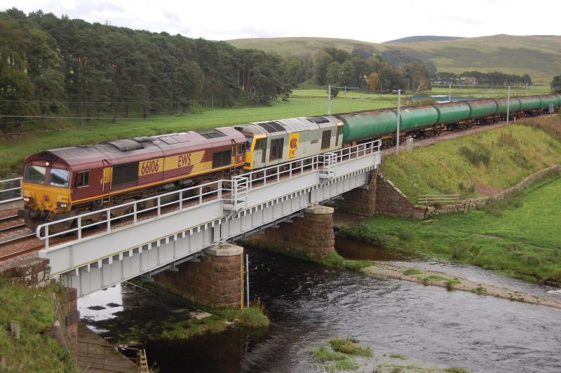Tugging a tug: 60099 failed while working 6S36 Dalston-Grangemouth on 12/09/08 and was rescued by 66106. Seen here crossing the Clyde at Crawford Photo of Tugging a tug