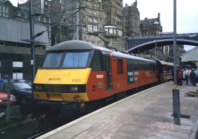 Waverley departure: 90020 COLONEL BILL COCKBURN CBE in the old Parcels Sector colours with a return InterCity Land Cruise in August 1993. Photo of Waverley departure