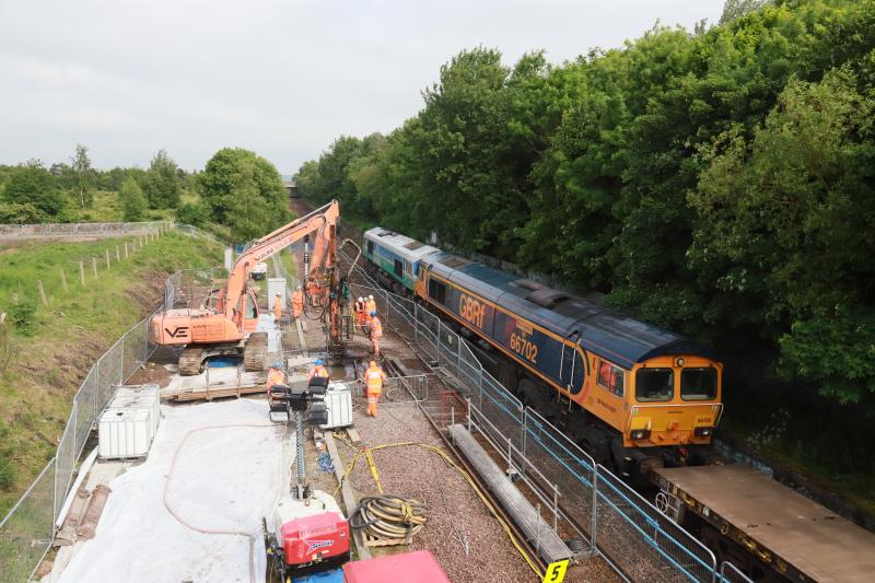 6S50: 66711 + 66702 on 6S50 12.16 Carlisle to Millerhill at Niddrie West Jct running wrong line passing the site of the void on 04/06/2018 Photo of 6S50