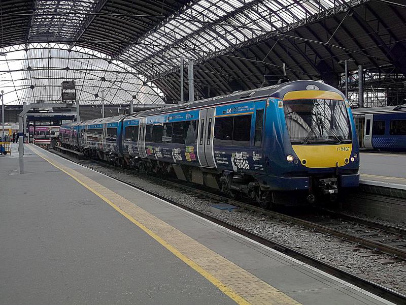 170407 at Glasgow Queen Street: Sporting its all over advert for BT Police. ScotRail Turbostar 170407 waits at Glasgow Queen Street for its next turn of duty on Wednesday 13th June 2018. Photo of 170407 at Glasgow Queen Street