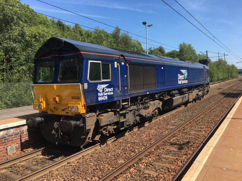 Singular Shed: DRS 66426 on a light loco move from Motherwell TMD - Millerhill pauses on a red at Holytown running slightly early. Photo of Singular Shed