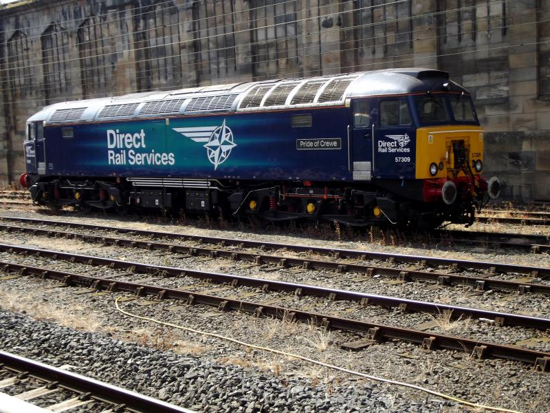57309 at Carlisle: DRS Thunderbird 57309 Pride of Crewe waits at Carlisle for its next turn of duty of Saturday 7th July 2018. Photo of 57309 at Carlisle