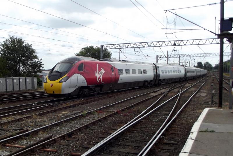 390043 at Carlisle: Sporting the latest Virgin Trains livery, 390043 leaves Carlisle with a service from Edinburgh Waverley to London Euston on Saturday 7th July 2018 Photo of 390043 at Carlisle