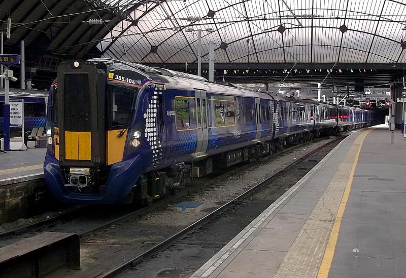 385104 at Glasgow Queen Street: Now in passenger service Hitachi 385104 arrives at Glasgow Queen Street on Monday 30th July 2018, with the 1415 service from Edinburgh Waverley. On the rear is classmate 385003. Photo of 385104 at Glasgow Queen Street