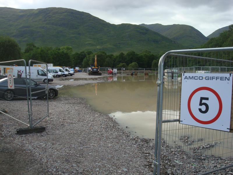 River Orchy Viaduct - Contractor Area: Contractor (AMCO GIFFEN) at River Orchy Viaduct site. Slightly flooded but provide more car parking space for visit to nearby Kilchurn Castle in future? Photo of River Orchy Viaduct - Contractor Area