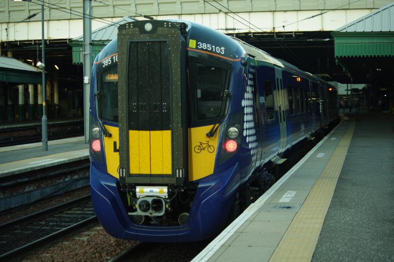 385103 Edinburgh Waverley: In platform 14 ready to operated the 1915 to Glasgow Queen Street o 04Sep18. Note the different location of the unit number above the cab, compared to the photo of 385123. Photo of 385103 Edinburgh Waverley