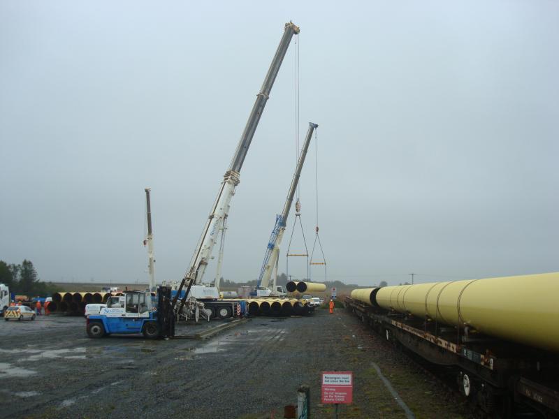 Unloading LD Pipes at Georgemas: Taken on 3rd Oct 2018. Very rapid process taking around 5 mins per wagon including wagon moves. Pipe wagons were a mixture of YLA and BRA types. Photo of Unloading LD Pipes at Georgemas