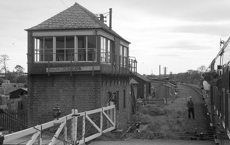 Coupar Angus South signalbox 1974: Token exchange as the Strathspey Railway Association's 'Strathmore Express' returns from Forfar on 25 May 1974. Photo of Coupar Angus South signalbox 1974