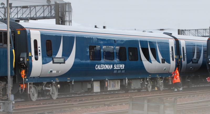Caledonian Sleeper Livery: Seen at Polmadie Down Holding Sidings on 2018-11-12.
A set of Caledonian Sleeper Branded coaches seen today Photo of Caledonian Sleeper Livery