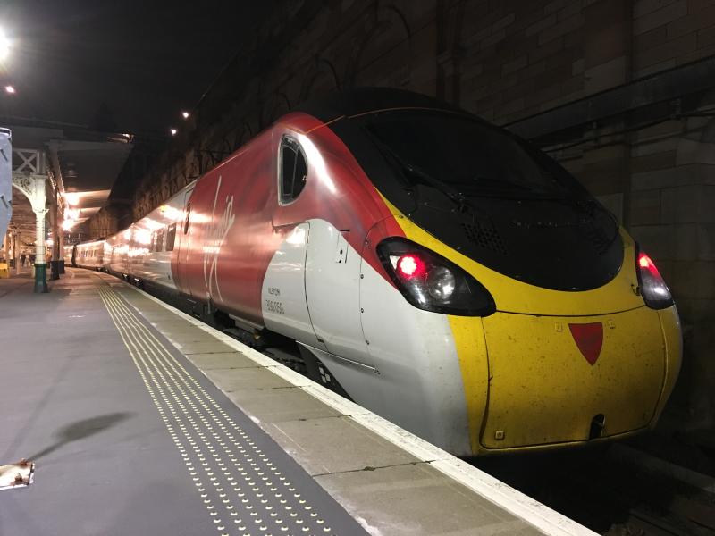 390050: Having terminated with a service from London Euston, 390050 stands at Edinburgh Waverley awaiting its next duty. Photo of 390050