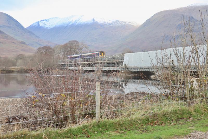 River Orchy Viaduct - Sand Blasting Progressing: Today's 1Y24 Oban to QS passing over the River Orchy Viaduct. Sand blasting continues. As far as I can see final paintwork has not yet started. Photo of River Orchy Viaduct - Sand Blasting Progressing