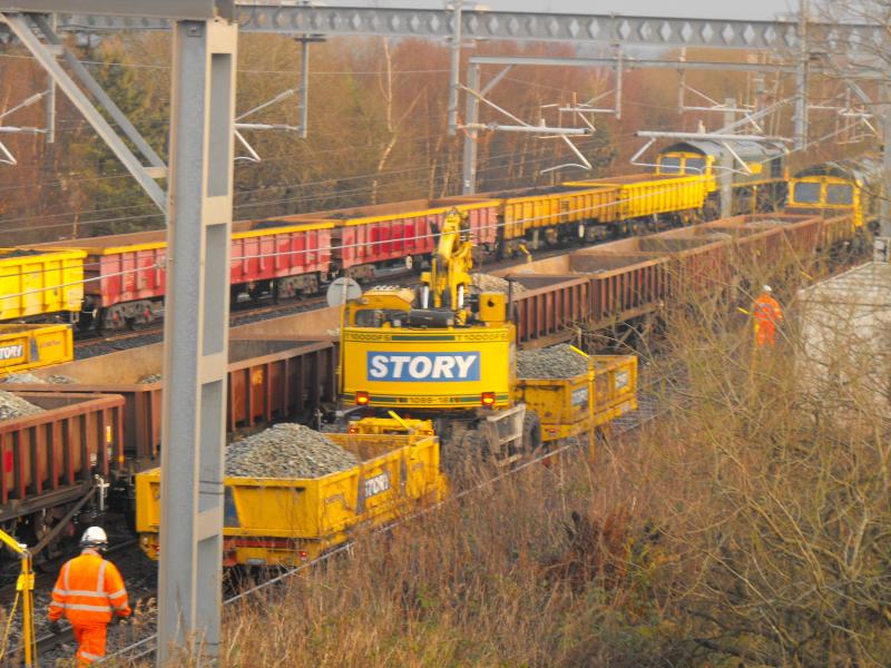 road rail machine: Road rail machine at High Bonnybridge. Pushing and pulling loaded trays with ballast on Boxing day. Photo of road rail machine