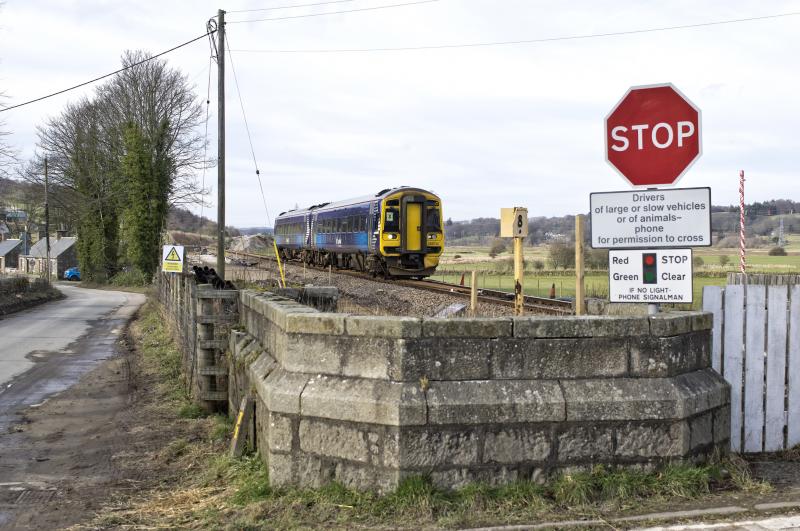 158712 RETURNS WITH AN INVERURIE ABERDEEN SERVICE 24.2.19.jpg: NOTE THE BASE OF THE GNSR SIGNAL BOX IMMEDIATELY NEXT TO THE LEVEL CROSSING AT THE LONG CLOSED SITE OF PITMEDDEN STATION Photo of 158712 RETURNS WITH AN INVERURIE ABERDEEN SERVICE 24.2.19.jpg