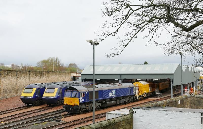 Photo of 66432 setting back into the carriage sheds next to the two Scotrail training HST's  