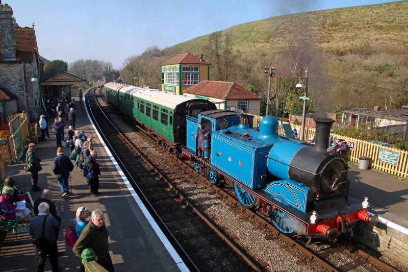 Busy scene: The up platform at Corfe is busy as 419 pauses. The tall signalbox is a replica of the original LSWR structure and was opened in 2012. Photo by Andrew P.M. Wright Photo of Busy scene