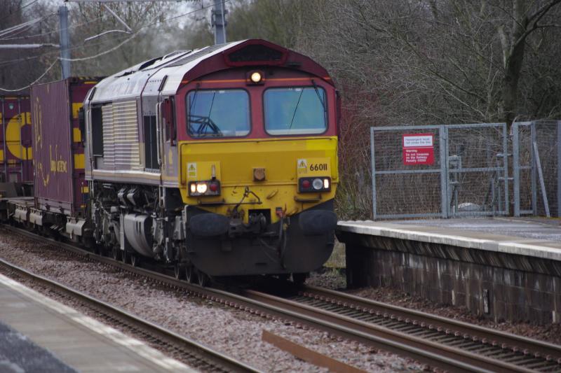 66011 Greenfaulds 18/03/19: Still in EWS colours, 66011 leads the Mossend-Grangemouth containers. Photo of 66011 Greenfaulds 18/03/19