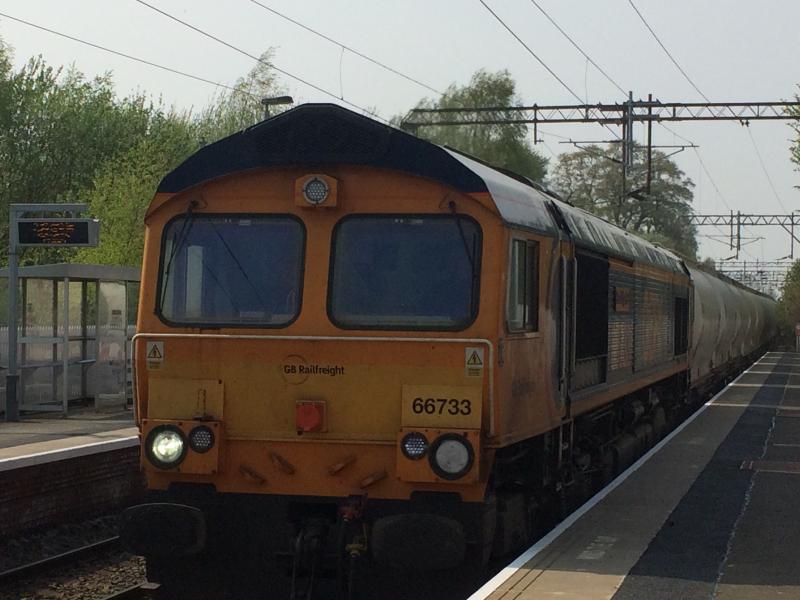 GBRF 66733 passing Bowling: GBRF 66733 'Cambridge PSB' passes Bowling whilst working the 6E45 08:07 Fort William to North Blyth empty alumina train on Wednesday 24th April 2019. Photo of GBRF 66733 passing Bowling