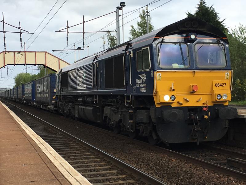 66427 on 4S43: Going via Shotts due to engineering work on the WCML, DRS 66427 heads the Tesco train past Holytown for Mossend. Photo of 66427 on 4S43