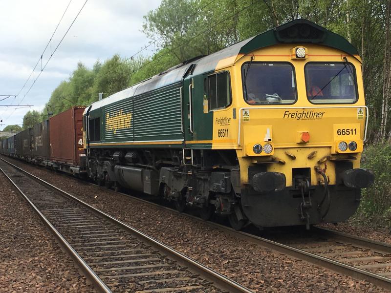 66511: Working a Coatbridge - Daventry intermodal via Shotts, approaching Holytown on 05/05/2019 Photo of 66511