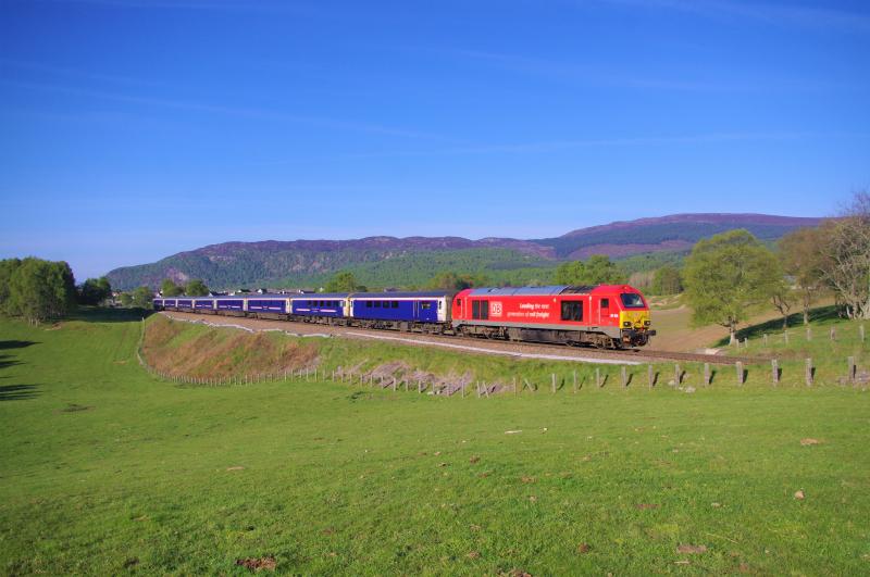 67015: 67015 1S25, Northbound Sleeper through Aviemore, in the last few weeks of the sleeper being worked by the MK2/3 stock. 14 May 19 Photo of 67015