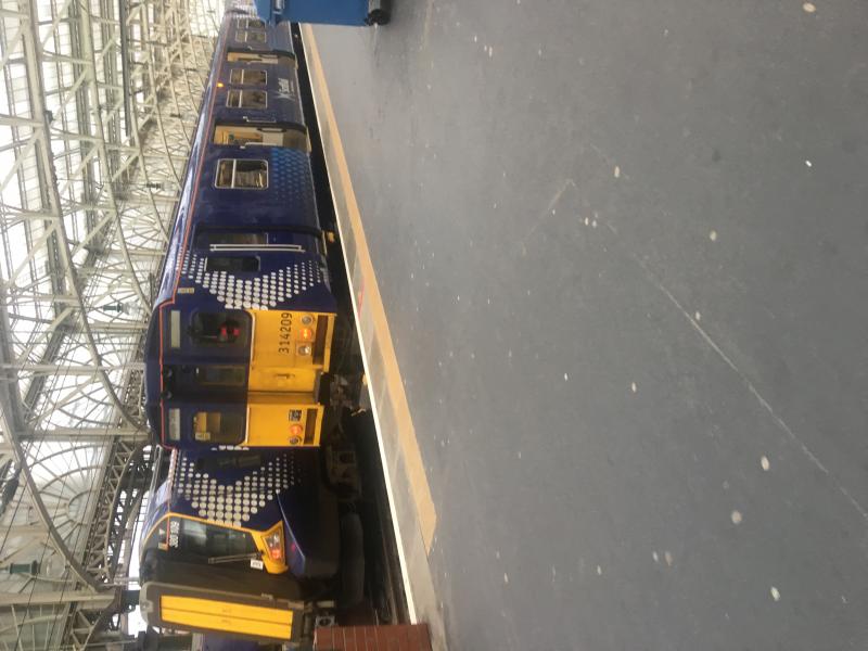 314209: 314209 seen at Glasgow Central prior to working the 2042 to Paisley Canal on Saturday 1/6/19. 380109 alongside before working to Largs Photo of 314209