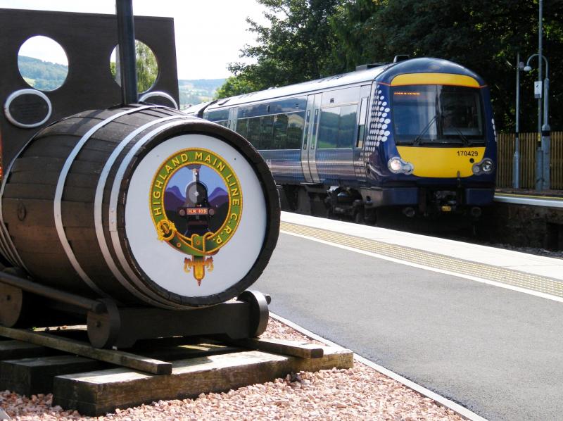 Barrel of fun @ Pitlochry - 5 August 2019: 170429, Edinburgh to Inverness '1H11', passing the 'barrel engine' of the Highland Main Line Community Rail Partnership's floral train. Photo of Barrel of fun @ Pitlochry - 5 August 2019