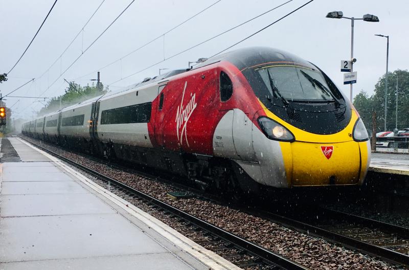 Pendolino in a Downpour: Uddingston station, 390112 working a service to London Euston dashing through in traditional Scottish weather. Photo of Pendolino in a Downpour