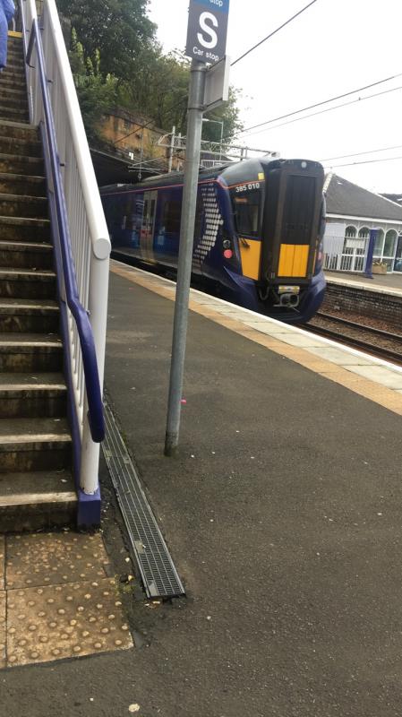 385010: 385010 departing Greenock Central heading for Gourock on 16/9/19. A few bemused American visitors from Crown Princess were comparing it to the old ‘cars’ they got to Glasgow earlier in the day Photo of 385010