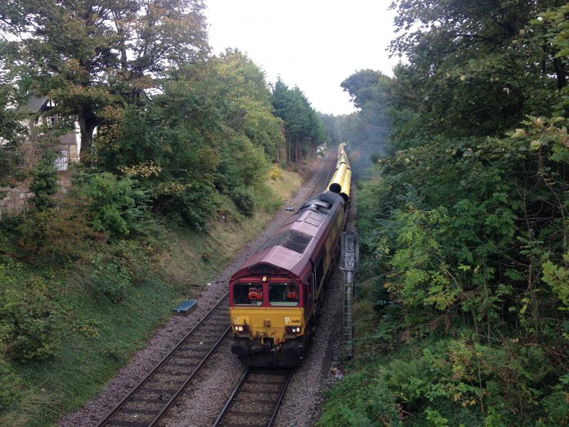 66110: DBC 66110 works hard up the hill to Morningside (Sub) at
Braid Avenue with Hartlepool to Georgemas Junction North Sea pipes. 24.09.2019 Photo of 66110