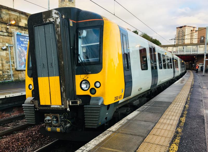 Vanilla Desiro: Pure white unbranded with grey doors TPX Class 350 Desiro EMU no. 350403 stands at Motherwell with a service from Manchester Airport to Glasgow Central. Photo of Vanilla Desiro