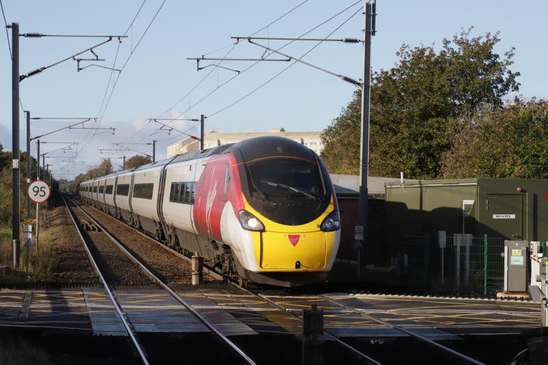 390127: 390127 on 1S36 06.16 Birmingham New Street to Edinburgh passing over the Level Crossing at Kingsknowe on 12/10/2019. Livery will soon Disappear Photo of 390127