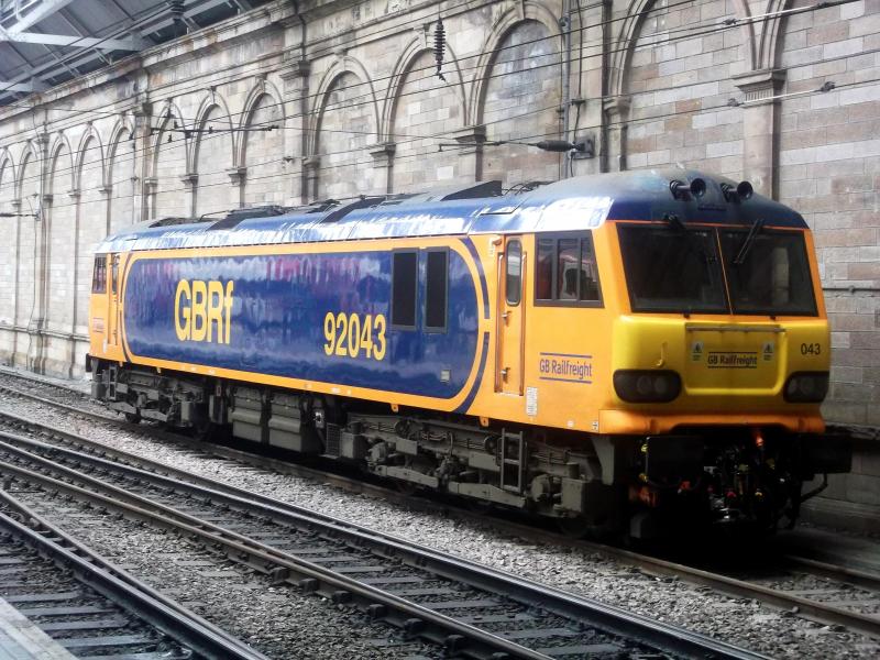 92043 at Edinburgh Waverley: GBRf freight liveried 92043 waits on its next turn of duty on the Caledonian Sleeper, at Edinburgh Waverley on Wednesday 16th October 2019. Photo of 92043 at Edinburgh Waverley