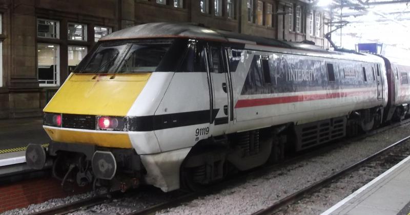91119 at Edinburgh Waverley: LNER 91119 in Retro BR Inter City Swallow livery waits at Edinburgh Waverley for its next trip South on Wednesday 16th October 2019. Photo of 91119 at Edinburgh Waverley
