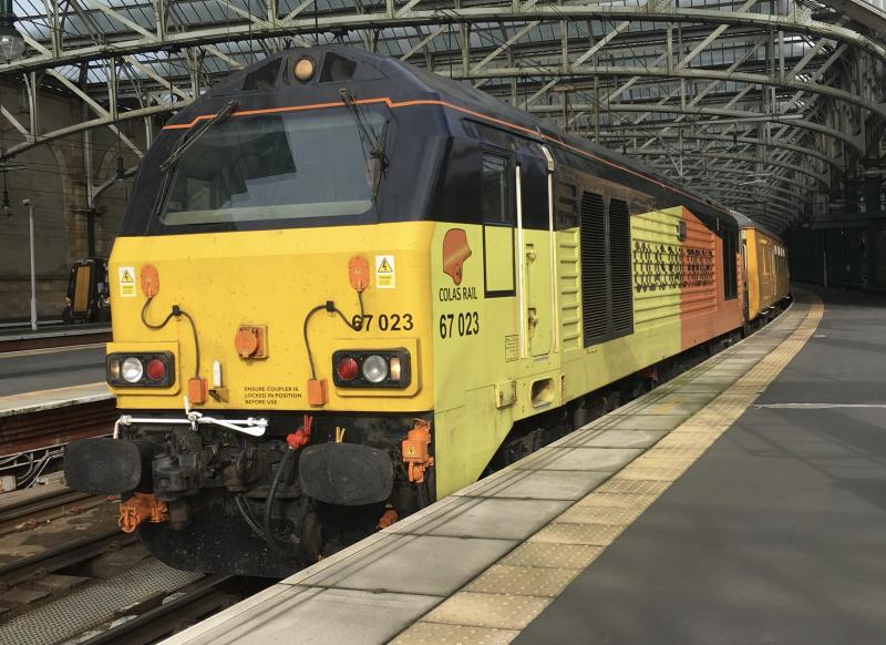 Sunbaked Skip: Leading 1Q26 out of Glasgow Central bound for Edinburgh, Colas Class 67 no. 67023 alongside 67027 on the rear substituting for the NMT on the 15/10/2019 Photo of Sunbaked Skip