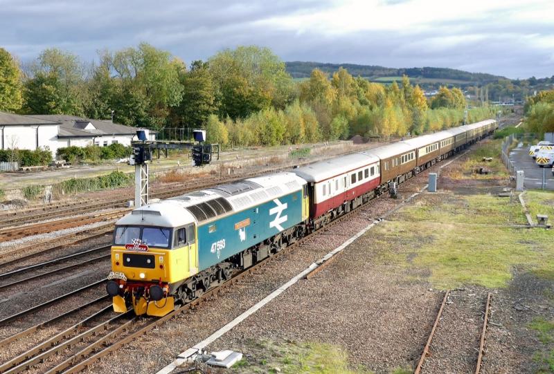 Photo of 47593 with ' Lord of the Isles Statesman 'railtour arriving at Perth. D1924 on rear.