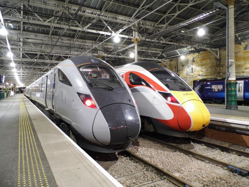 802203 Waverley 30/10/19: Three Hitachis- 802203 in p5 Waverley on 3S13 1629 Newcastle- Edinburgh sits next to 800102 in p6 Waverley on 1300 London Kings Cross- Edinburgh with a class 385 in the background Photo of 802203 Waverley 30/10/19