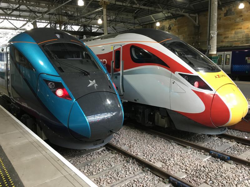 Same Design/Different Styling: TPE 802 209 and LNER 800 112 side by side. Edinburgh
Waverley 10.11.2019 Photo of Same Design/Different Styling