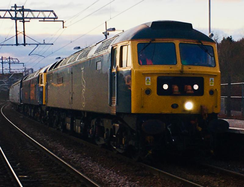 Dusky Duffs: Running just short of an hour down after being nearly 2 hours late leaving Kilmarnock, 47727 and dead 47739 with two barrier wagons speed through Kirkwood on 5Q18. Photo of Dusky Duffs