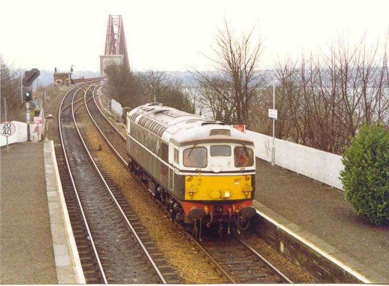 First of the line: The original BRCW Type 2/ Class 26 D5300/ 26007 coming off the Bridge into North Queensferry in 1993 heading for Thornton when working on the local Fife area ballast trip. Photo of First of the line