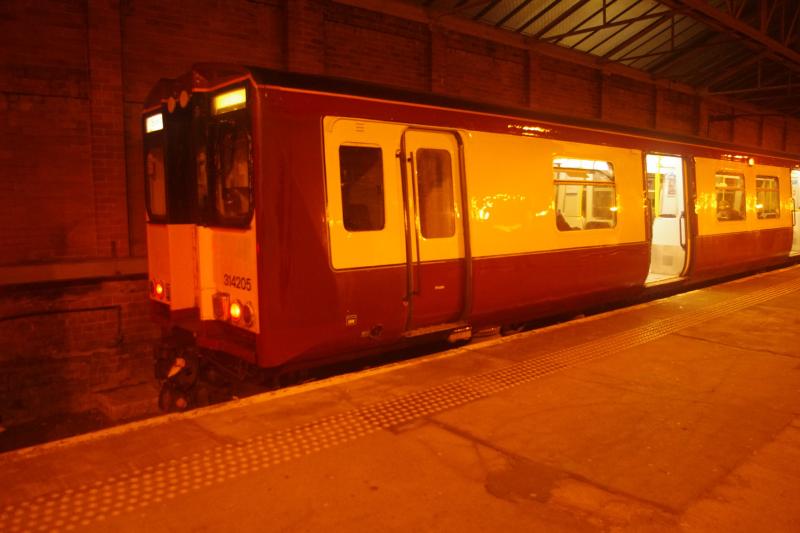 In the dark: under the lights at Helensburgh Central, 314205 sits at the buffer stop in platform 3. Photo of In the dark
