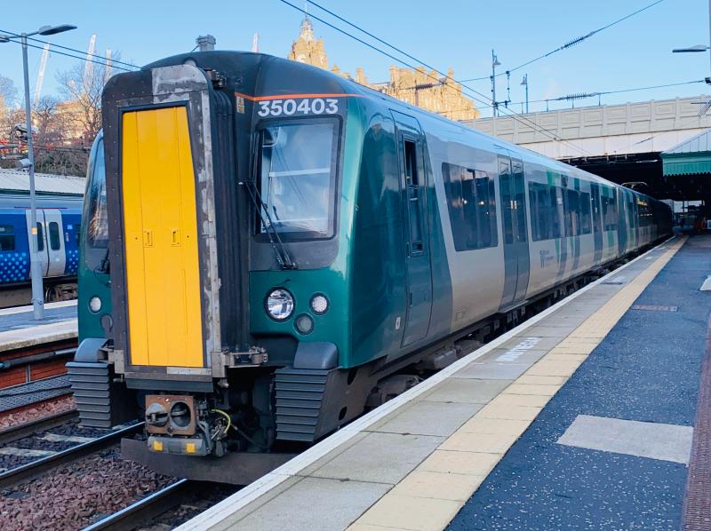 Identity Crisis Desiro: In LNWR livery, but still working under Transpennine Express, Class 350/4 Desiro 350403 leaves Edinburgh Waverley to kick off the 1M99 service to Manchester Airport. Photo of Identity Crisis Desiro
