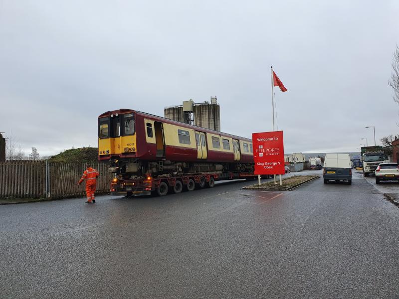 314205 makes its final journey: On 22 January 2020 a driving coach from 314205 is captured by my brother while being carefully manoeuvred into Peelports' King George V Dock in Glasgow having reached journey's end. Photo of 314205 makes its final journey