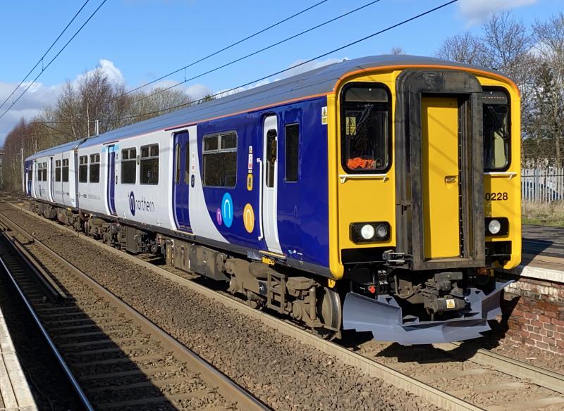 Further Northern: Shiny new 150228 working from Kilmarnock to Newton Heath, seen at Holytown in the morning sunlight. Photo of Further Northern