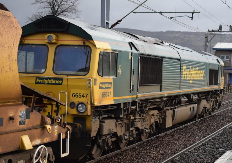 Bridge of Orchy C E - Millerhill: FL 66547 heads east through Dumbarton Central on 10.3.20 with autoballasters and 66506 on rear, running 26 late. Photo of Bridge of Orchy C E - Millerhill