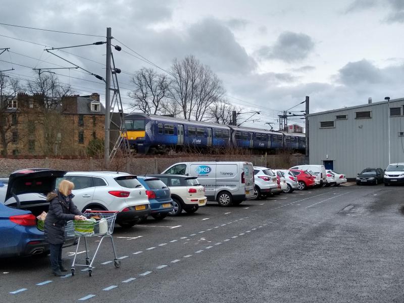 320403 Partick 14032020: 320403 passes the West End Retail Park (between Hyndland and Partick) at 13.05 on 14th March 2020. Photo of 320403 Partick 14032020